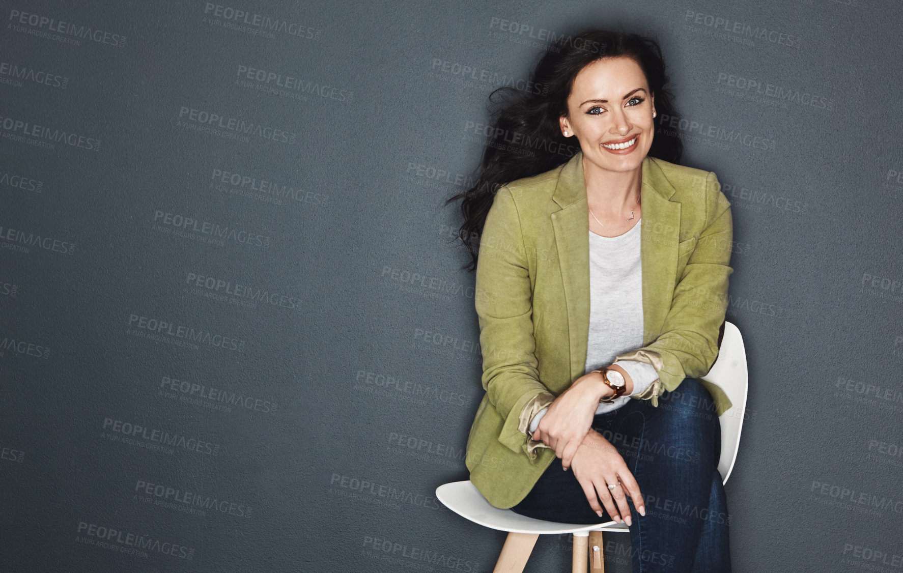 Buy stock photo Studio shot of a young attractive casual businesswoman posing against a grey background