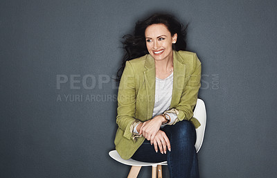 Buy stock photo Studio shot of a young attractive casual businesswoman posing against a grey background