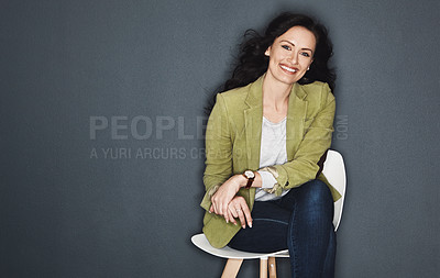 Buy stock photo Studio shot of a young attractive casual businesswoman posing against a grey background