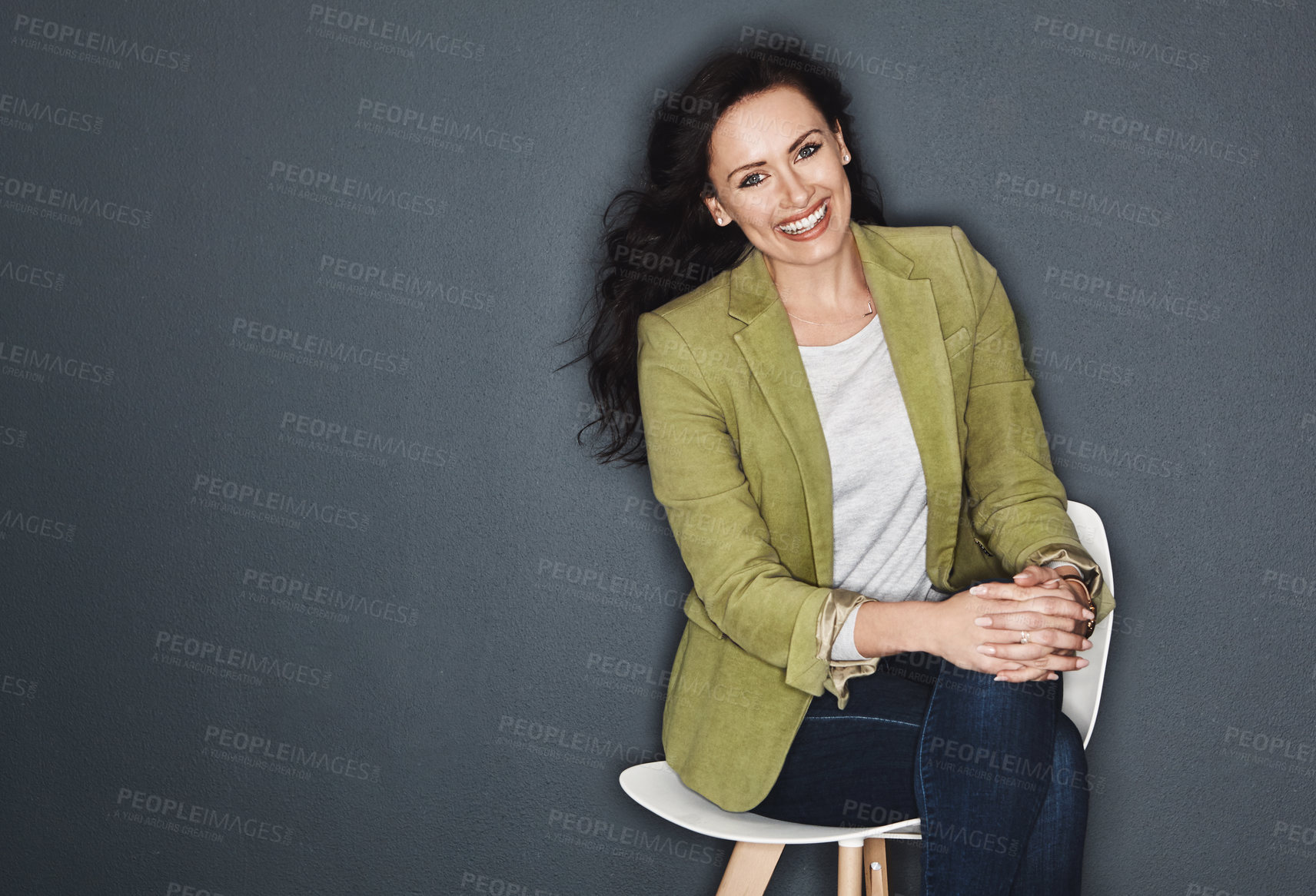 Buy stock photo Studio shot of a young attractive casual businesswoman posing against a grey background