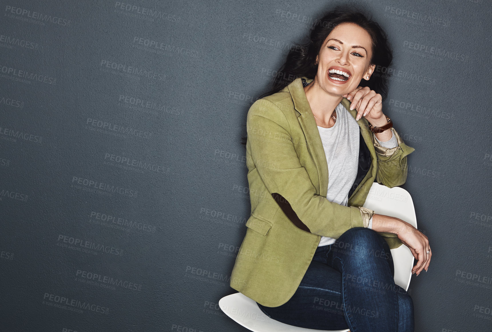 Buy stock photo Studio shot of a young attractive casual businesswoman posing against a grey background