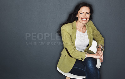 Buy stock photo Studio shot of a young attractive casual businesswoman posing against a grey background