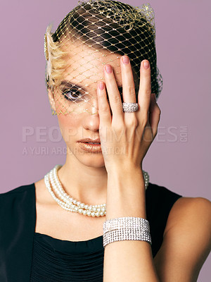 Buy stock photo Studio shot of an elegantly dressed young woman 