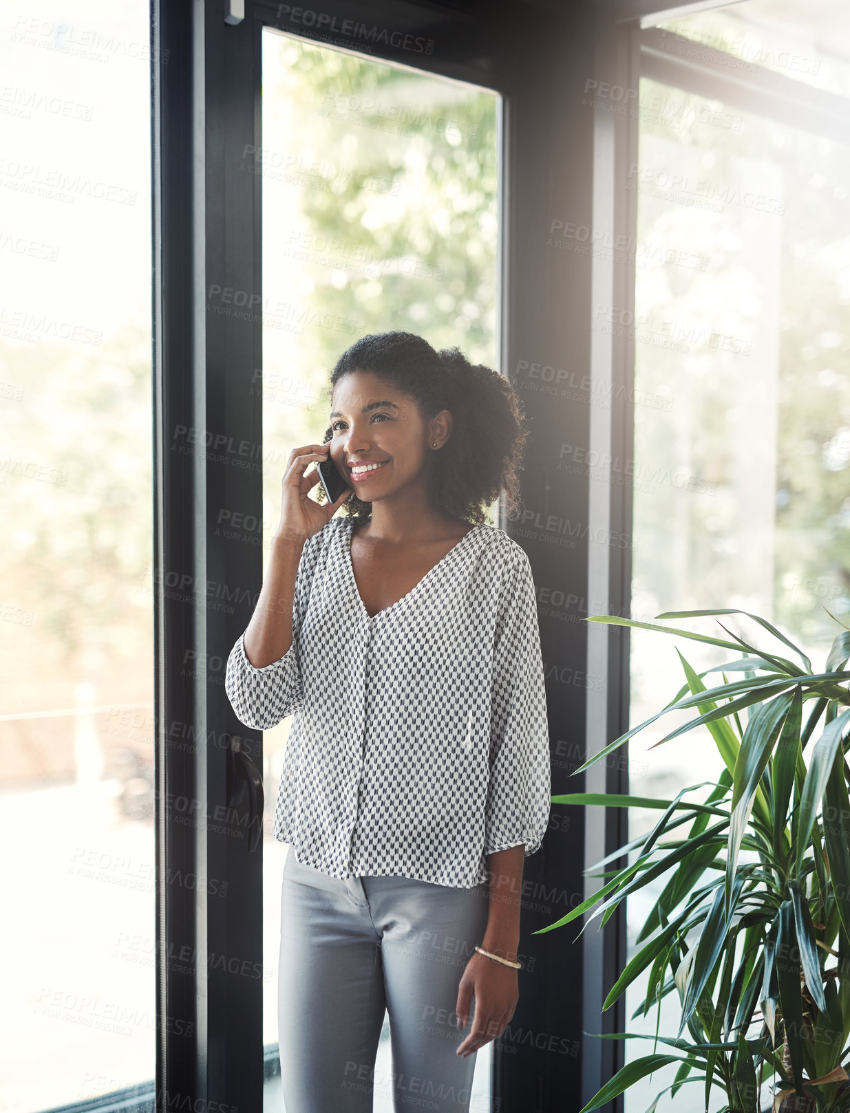 Buy stock photo Phone call, business or happy black woman in startup for networking, negotiation or development. Smile, window or proud African entrepreneur on mobile for talking, conversation or deal discussion