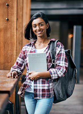 Buy stock photo Portrait of a young female student holding a tablet outside on campus