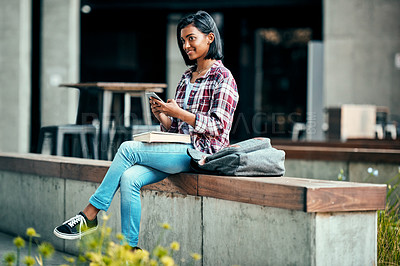 Buy stock photo Girl, university student and phone with book, outdoor and education with smile for walking at campus. Indian person, happy and smartphone with backpack, texting and chat on social media at college