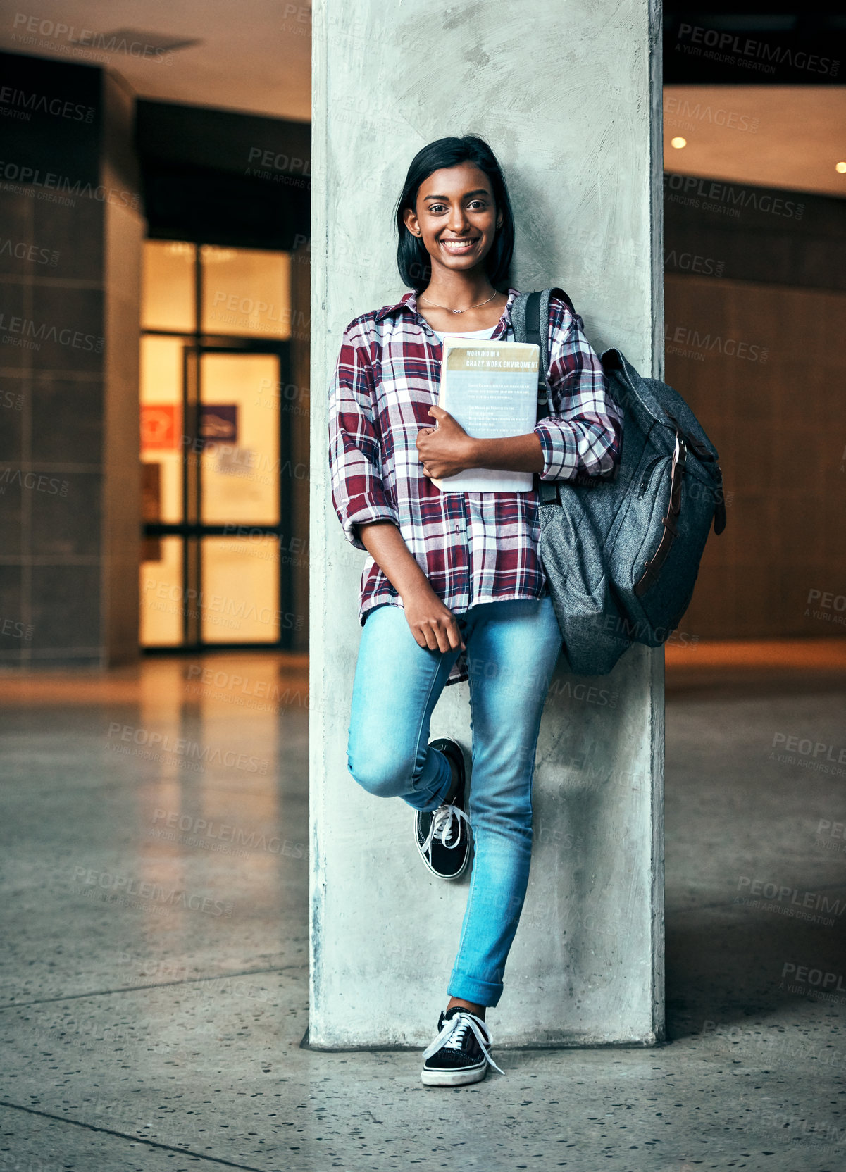 Buy stock photo Shot of a young female student outside on campus