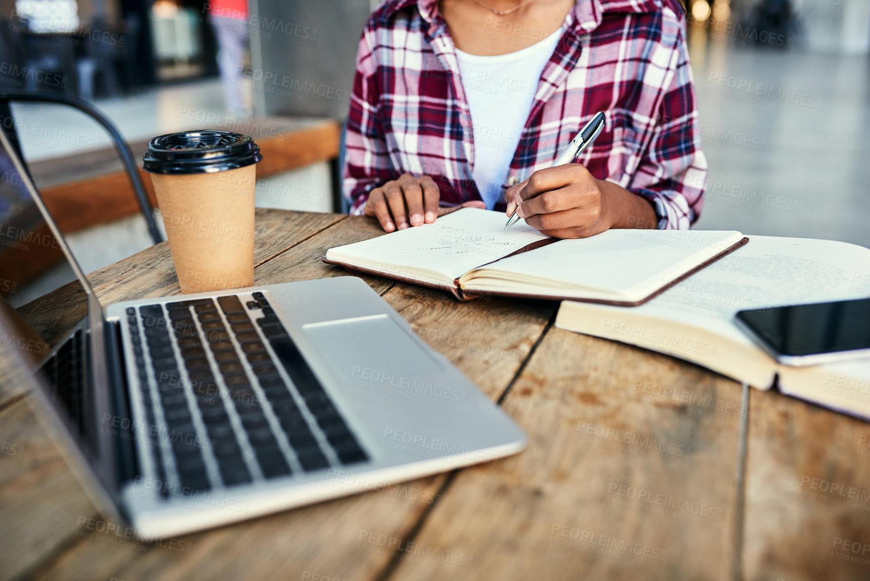 Buy stock photo Cropped shot of an unrecognizable female student studying outside on campus