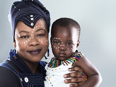 Buy stock photo African, culture or fashion with mother and child in studio on gray background for bonding or love. Development, family or growth with happy black woman and kid in traditional outfit for support