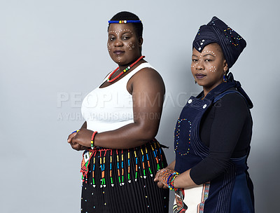 Buy stock photo Traditional, African and fashion with portrait of black people in studio for culture, identity and heritage. Pride, spirituality and community with women on white background for indigenous and honor