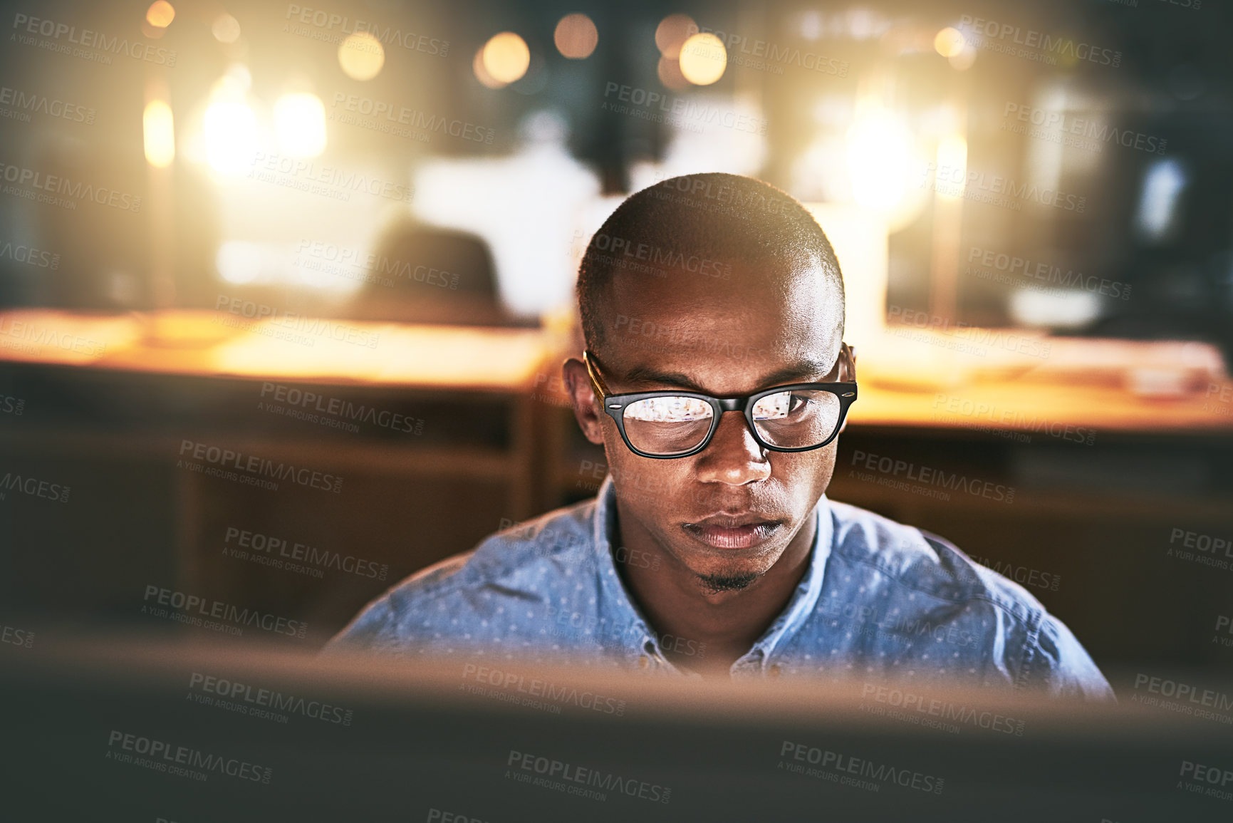 Buy stock photo Night, computer and business black man with glasses for website, research and reading news in office. Corporate, developer and worker online for software update, networking and working on web design