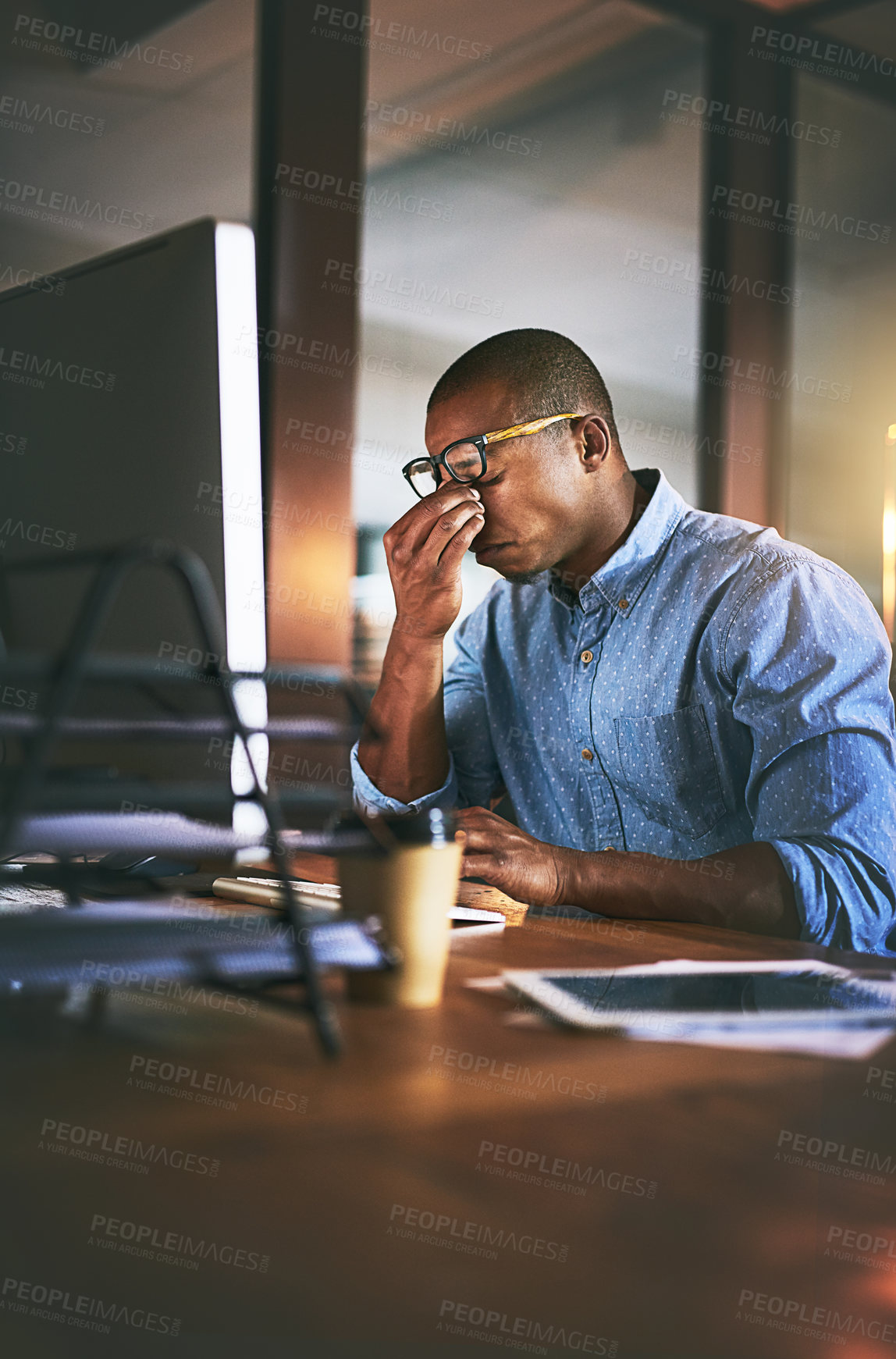 Buy stock photo African business man, stress and fatigue in night, office and headache by computer for project deadline. Black businessman, burnout or anxiety in workplace by pc, web design startup and mental health