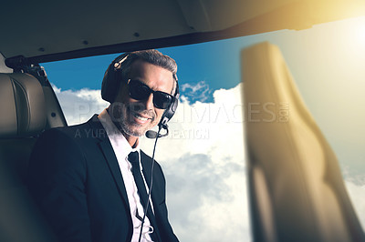 Buy stock photo Portrait of a mature businessman traveling in a helicopter