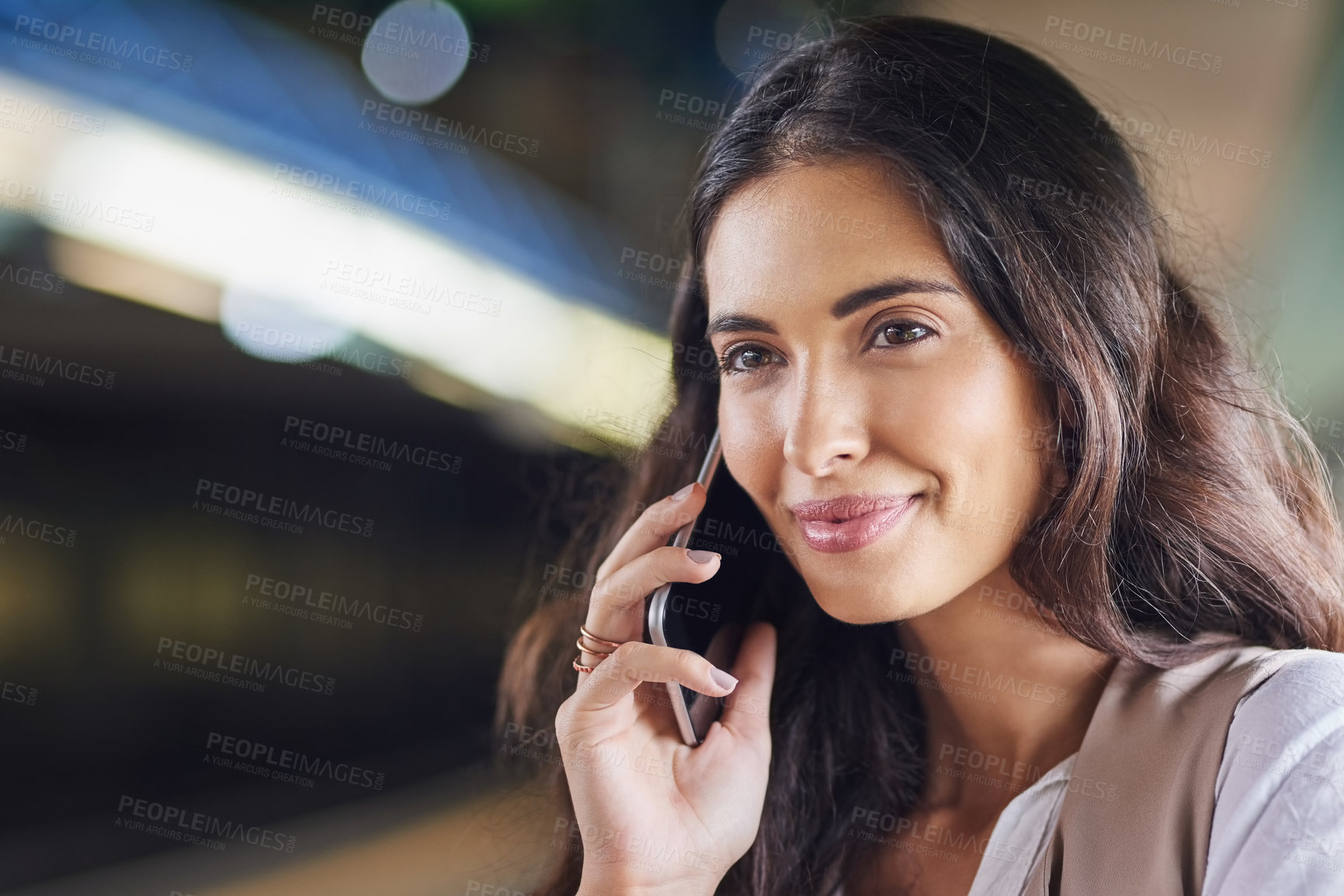 Buy stock photo Cropped shot of a young attractive woman on a call and using the train to commute