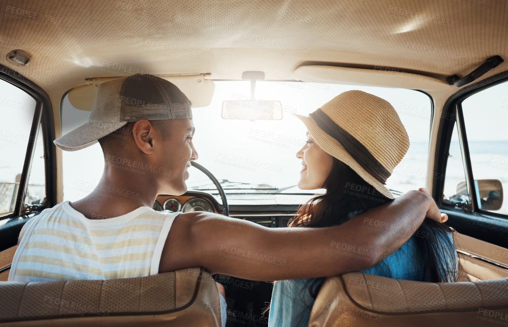 Buy stock photo Shot of a young couple enjoying a road trip along the coast