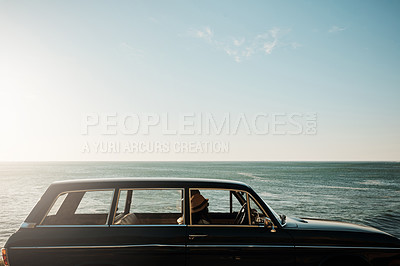 Buy stock photo Shot of a young woman going on a road trip along the coast
