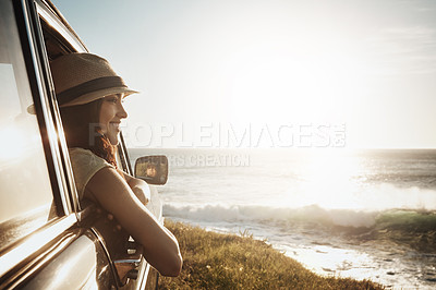 Buy stock photo Road trip, happy and woman in car window by ocean on holiday, vacation and summer weekend in countryside. Travel, sun and person in vehicle by seaside for transport, journey and driving adventure