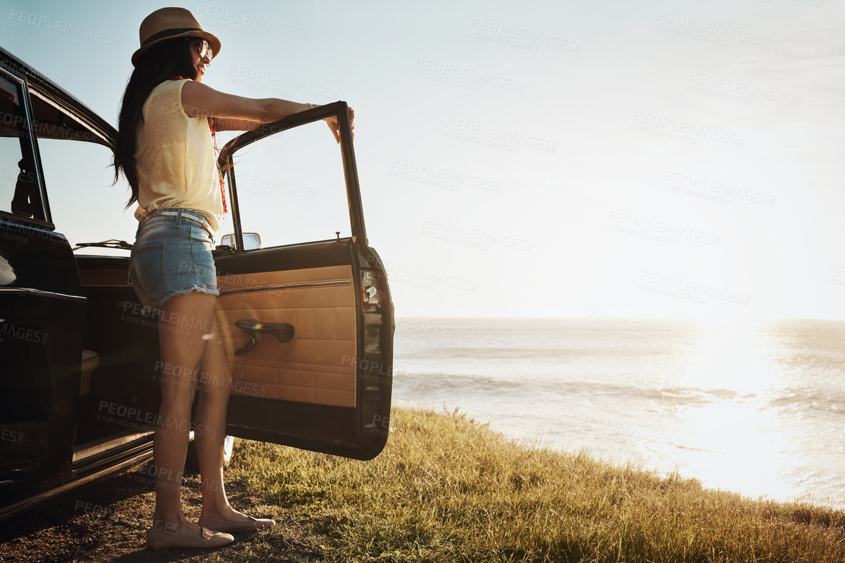 Buy stock photo Road trip, holiday and woman in car by sea on adventure, vacation and summer weekend in countryside. Travel, happy and back of person in vehicle by ocean for freedom, journey and transport in morning