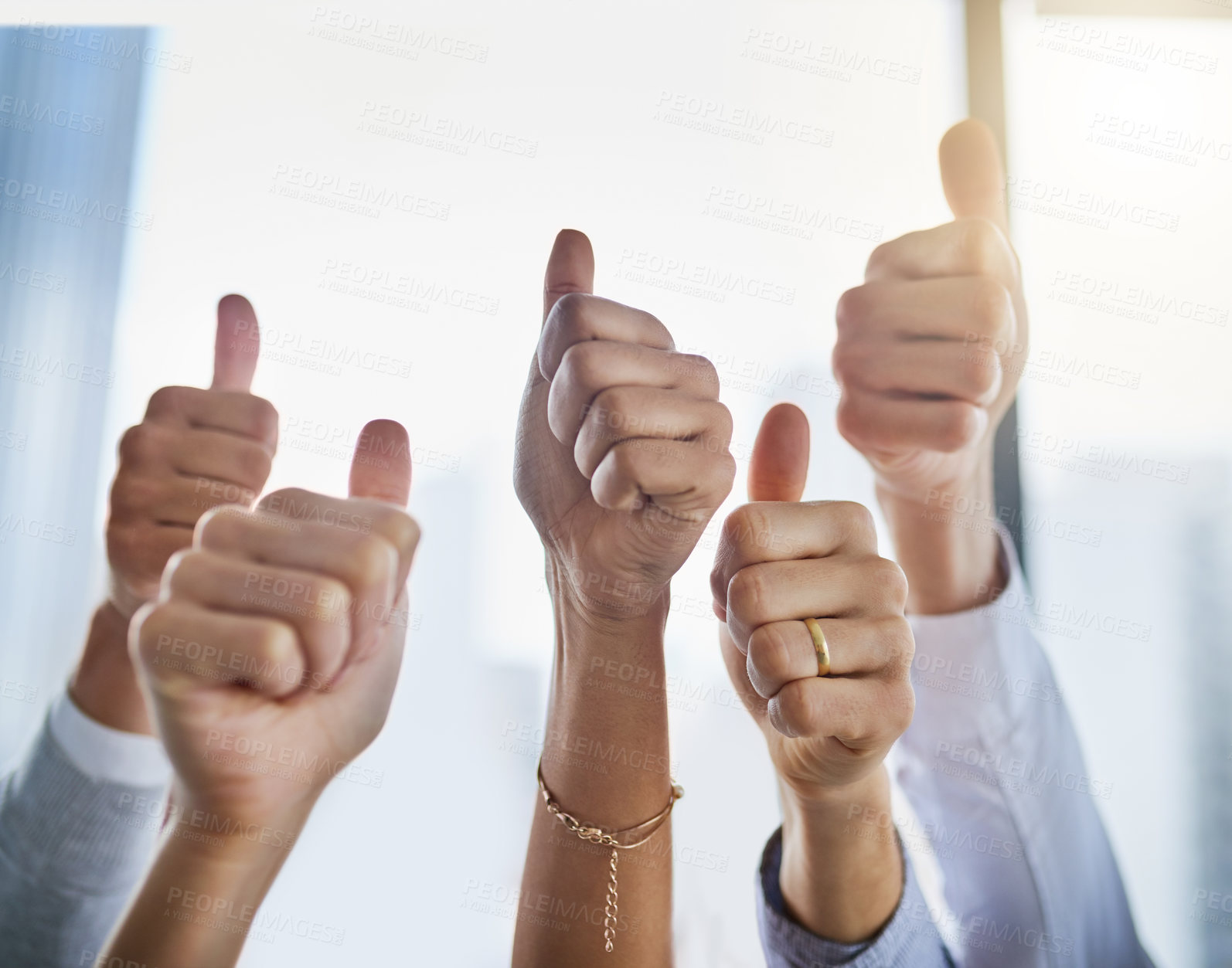 Buy stock photo Closeup shot of an unrecognizable group of businesspeople showing thumbs up in an office