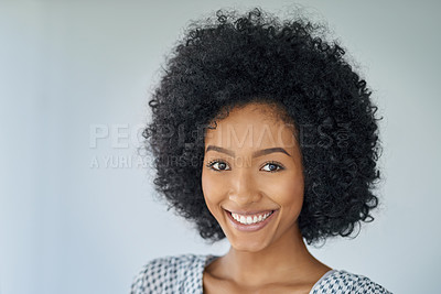Buy stock photo Portrait of a confident young businesswoman against a grey background