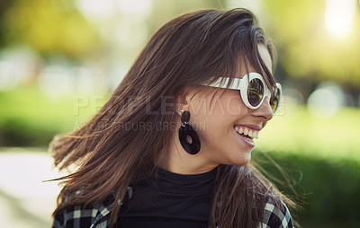 Buy stock photo Cropped shot of an attractive young woman spending the day outdoors