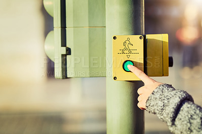 Buy stock photo Closeup shot of an unrecognizable woman pressing a button at a cross walk