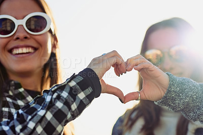 Buy stock photo Happy women, sunglasses and heart hands with friends for love, care or outdoor holiday together. Young, female people or girls smile with emoji, symbol or icon for weekend or freedom in joy or nature