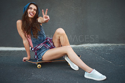 Buy stock photo Peace sign, skateboard and portrait of woman in city for hobby, activity or fun outdoor. Tongue out, skating and female person with trendy, stylish and streetwear fashion in urban town street.