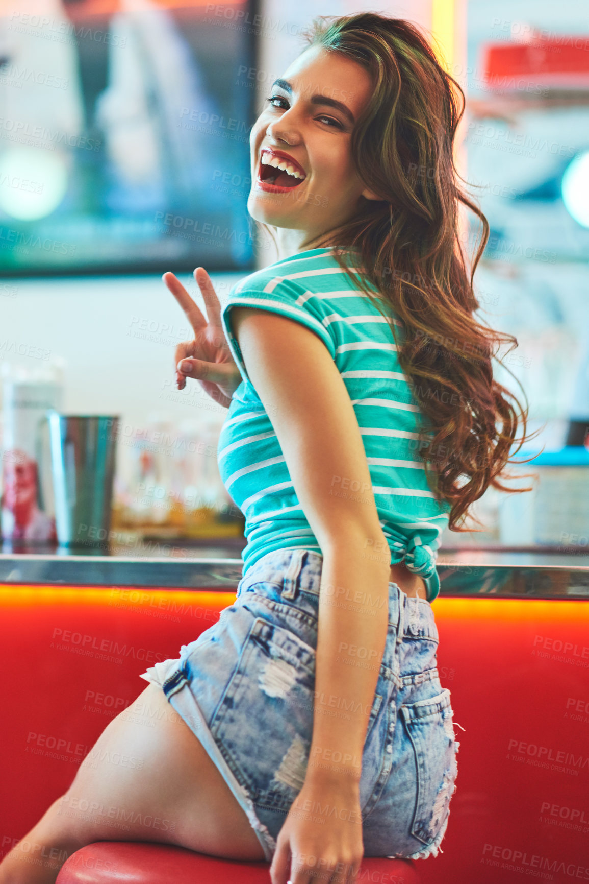 Buy stock photo Peace sign, portrait and smile with woman in diner, laughing for friendly hospitality or service. Makeup, relax and vintage with funny customer person in cafe or restaurant for break on weekend