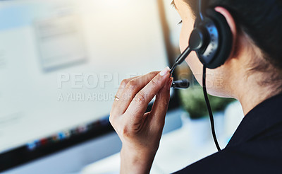 Buy stock photo Rearview shot of a young woman working in a call centre