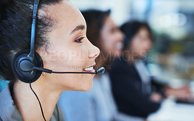 Buy stock photo Shot of a young woman working in a call centre