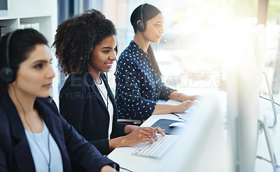 Buy stock photo Shot of young women working in a call centre