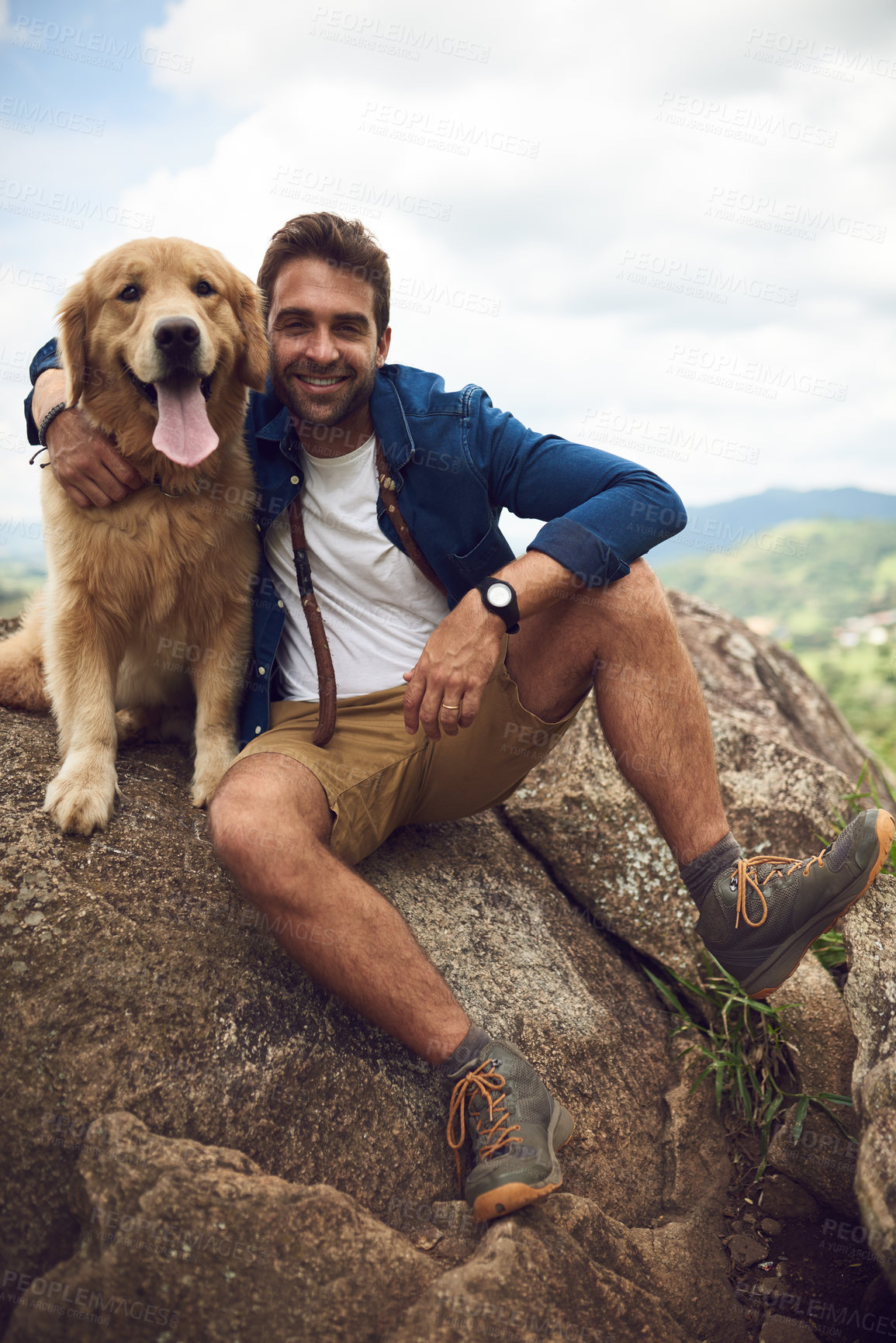 Buy stock photo Full length portrait of a handsome young man and his dog taking a break during a hike in the mountains
