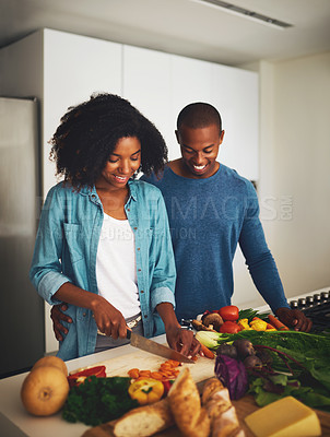 Buy stock photo Black couple, people and smile in kitchen with vegetables for cooking on diet, nutrition and health. Home, relationship and happy with fresh food for organic, vegetarian meal and wellness or dinner