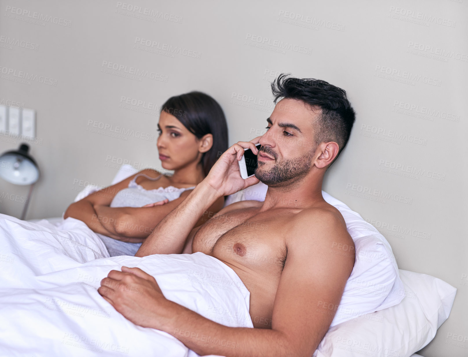 Buy stock photo Phone call, ignore and couple on bed in home for tension in argument, fight and no communication. Dating, relationship and man and woman on smartphone for talking, speaking and contact in bedroom