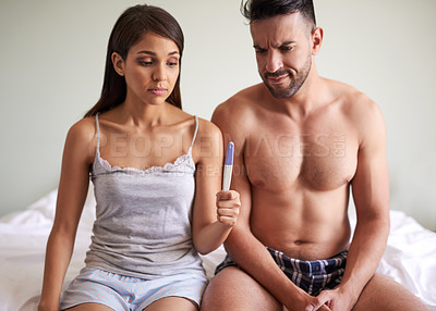 Buy stock photo Couple, waiting and pregnancy test with anxiety, together and connection in bedroom or house. Woman, man and reading for results as nervous for news, information and announcement as family planning