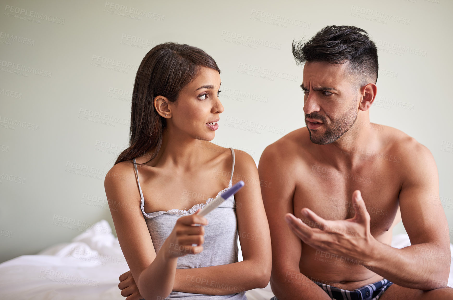 Buy stock photo Woman, man and waiting for pregnancy test with anxiety, together and frustrated in bedroom or house. Couple, reading and results as nervous for news, information and announcement as family planning