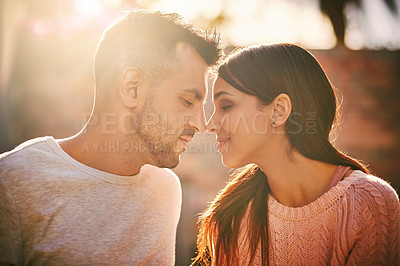 Buy stock photo Shot of a happy young couple spending time together outdoors