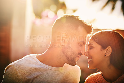 Buy stock photo Eskimo kiss, love and couple in nature for bonding, commitment and relax together in morning. Dating, lens flare and happy man and woman embrace for affection, care or support for loving relationship