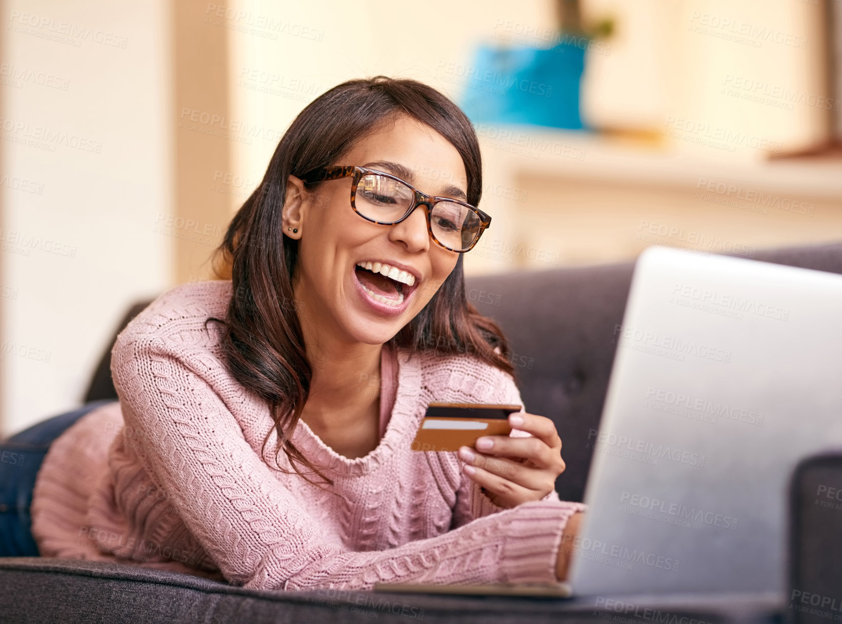 Buy stock photo Credit card, happy and woman with laptop on sofa with online shopping for dropshipping small business. Startup, computer and excited person with internet banking app to apply for finance loan at home