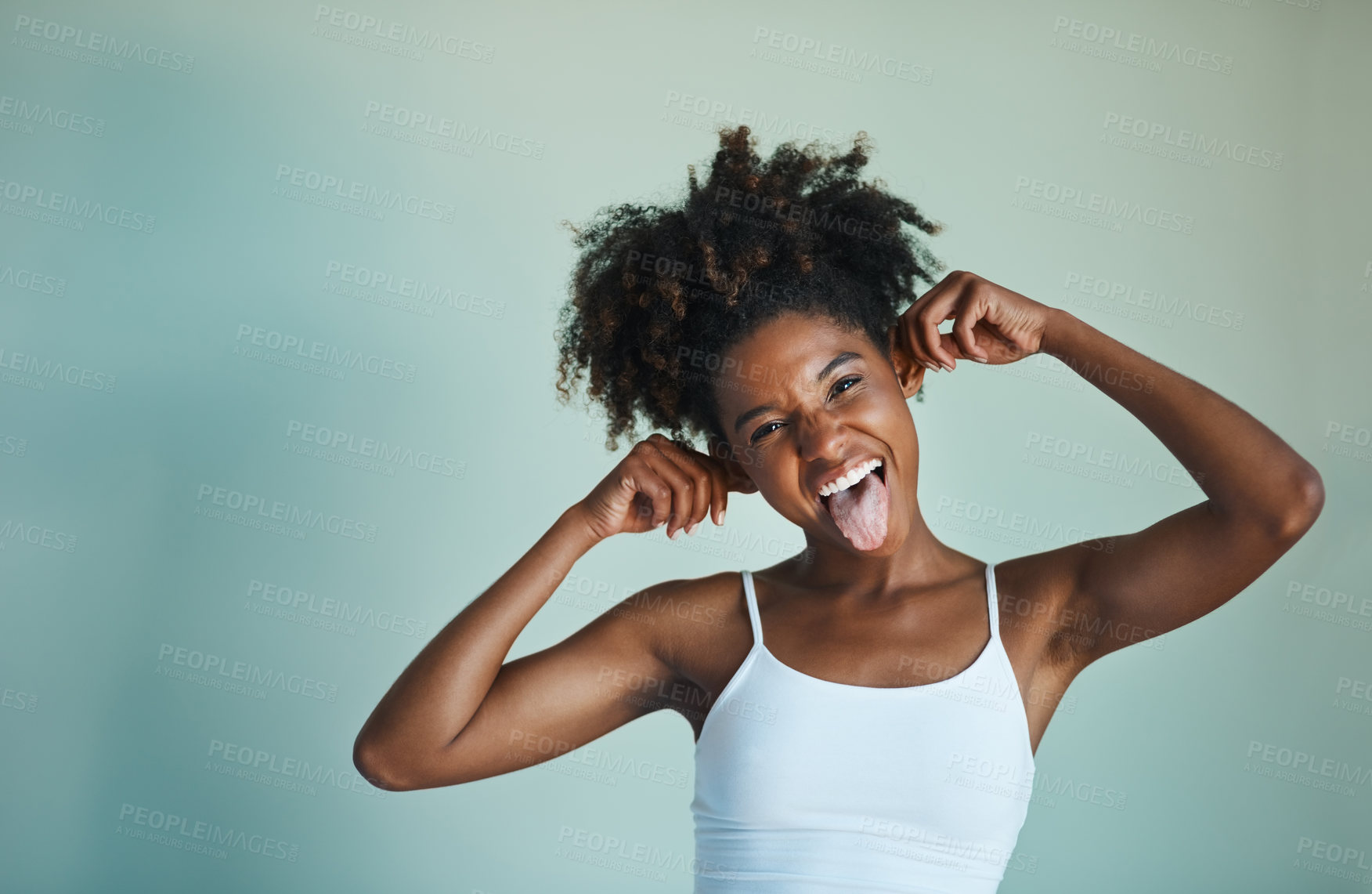 Buy stock photo Woman, wall and portrait with expression for playful, calm and peace in cozy or comfort in home. African girl, funny face and cheerful with happy or confident on background for joy, wellness or comic