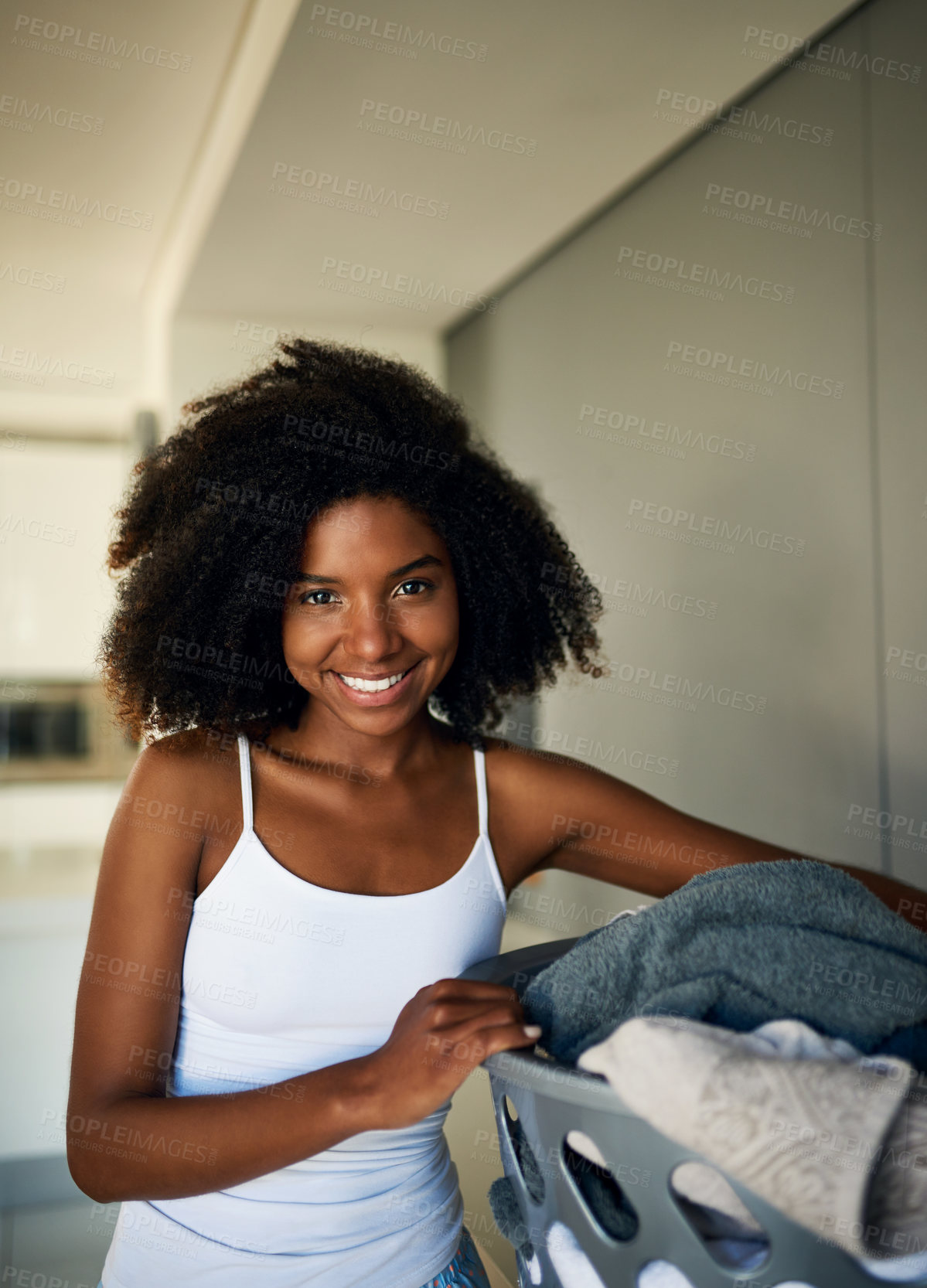 Buy stock photo Black woman, portrait and laundry basket in home with smile for spring cleaning, routine and hygiene. Person, happy and container with washing clothes for dirt, fabric and start housework in Kenya