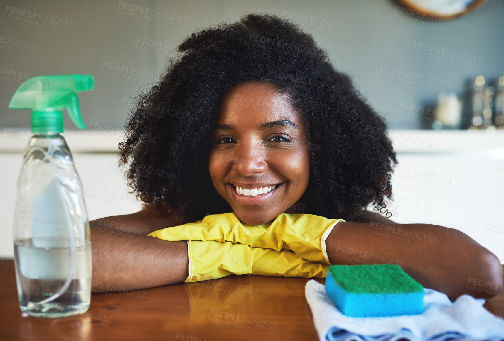 Buy stock photo Black woman, clothes and portrait by cleaning counter with spray, shine or gloves for bacteria in home. Person, happy and chemical for wood table, sponge or disinfection for hygiene at house in Kenya