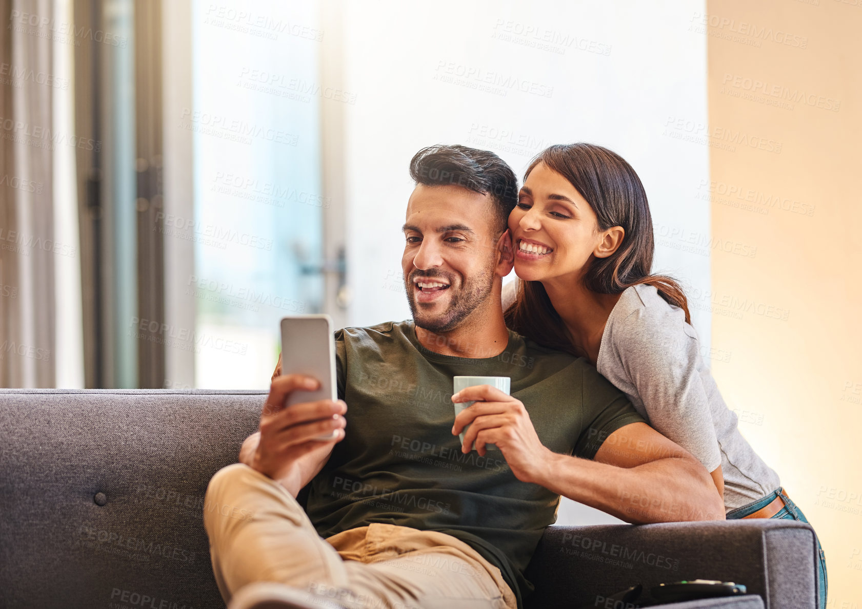 Buy stock photo Relax, selfie and couple in living room, smile and bonding with photography, happy or fun in home. Joy, woman and man with coffee, commitment and picture of moment, memory and people on sofa or house