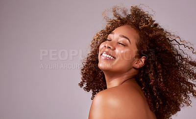 Buy stock photo Afro, hair and smile on black woman in mockup with confidence, pride or studio space. Natural haircare, curls and hairstyle on female model with growth, style and keratin treatment on pink background