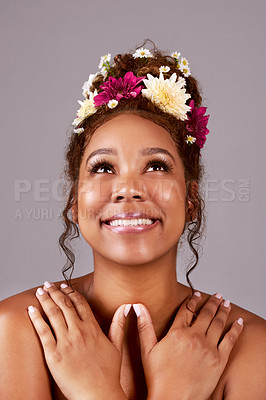 Buy stock photo Flower, crown and happy woman in studio for wellness, cosmetics or organic makeup on grey background. Eco friendly, dermatology and model smile with natural beauty, shine or glowing skin aesthetic