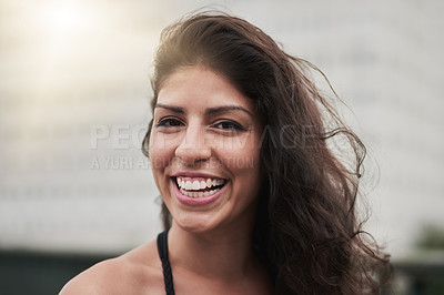 Buy stock photo Portrait of an attractive young woman out in the city