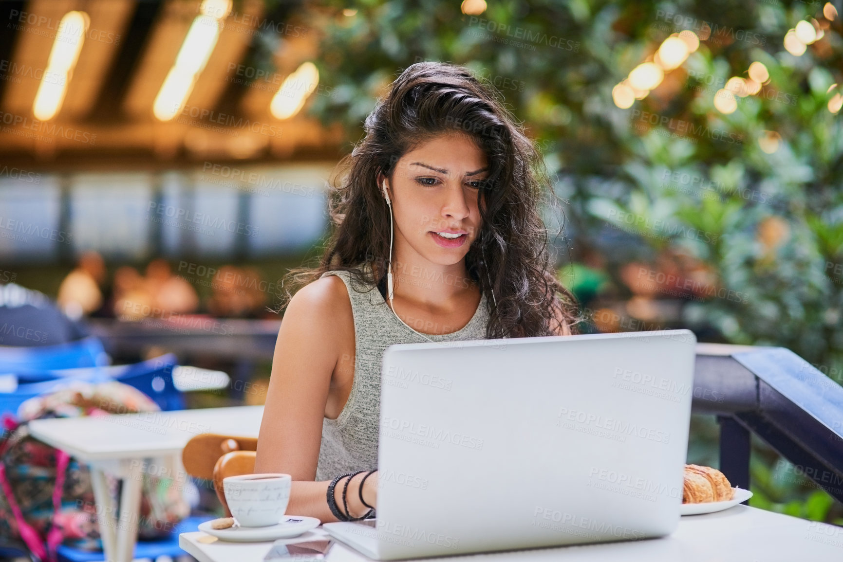 Buy stock photo Coffee, earphones and woman with laptop, working and research for funding of business, online and person. Cafe, entrepreneur and self publisher with computer for ebooks, writer and typing of pitch