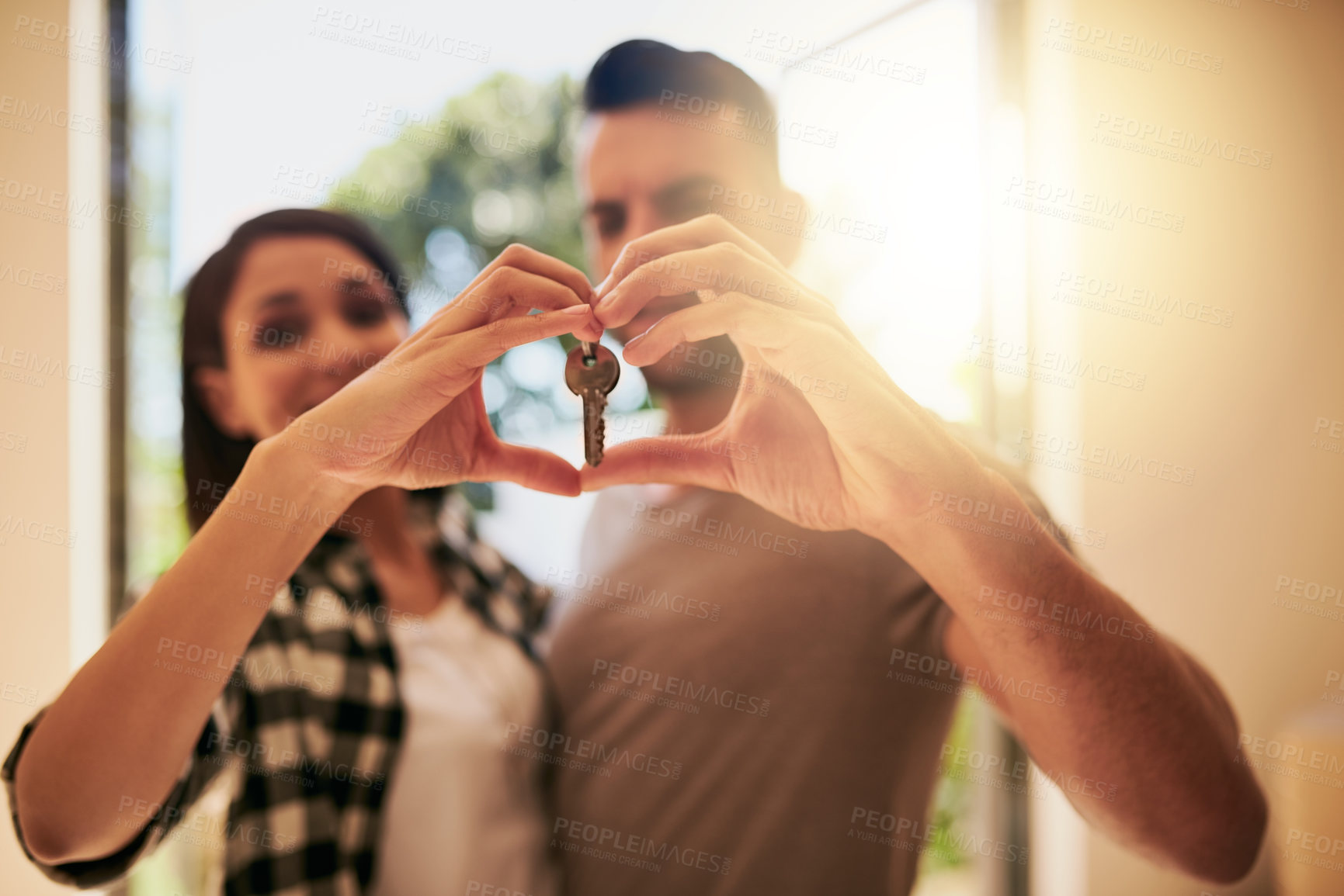 Buy stock photo Heart, hands and couple with a keys, home and happiness for growth, development and real estate. Partners, man and woman with new property, symbol for love and goals with achievement and apartment