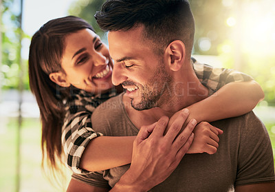 Buy stock photo Shot of an affectionate young couple bonding at home